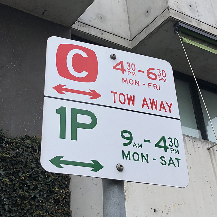 Signs showing Clearway and Tow away zone 4.30 to 6.30 pm Monday to Friday and a second sign indicating 1 hour parking between 9 am and 4.30 pm