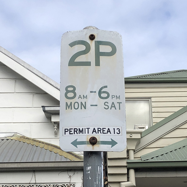 Parking sign for restricted time parking Monday to Saturday between 8 am and 6 pm.