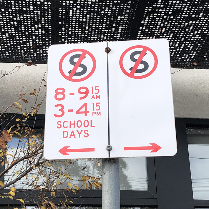 A no stopping, also known as a no standing, parking sign at specific times.