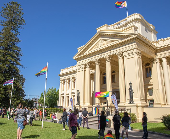 Council staff and community members gather to raise the Pride flag to mark the beginning of the Midsumma festival